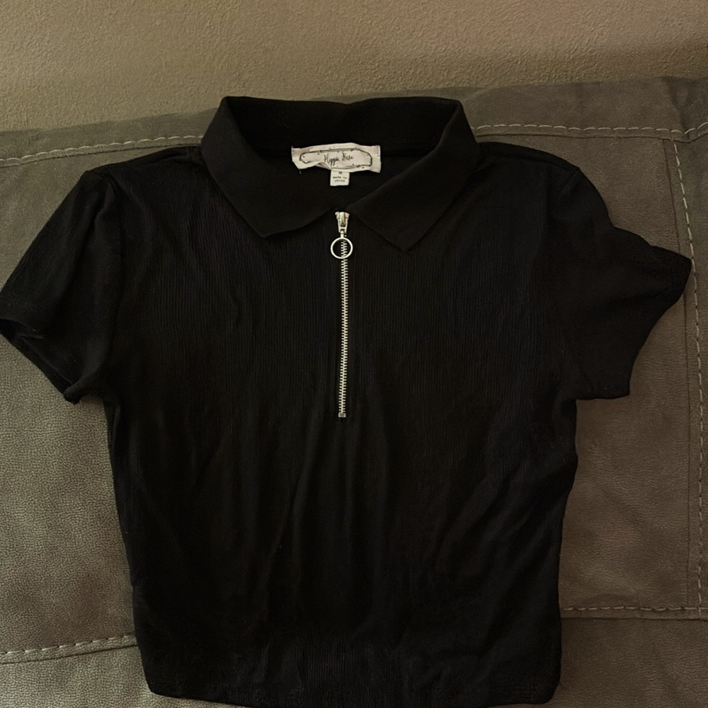 Black shirt with silver zip. Excellent condition. Size Medium. By Hippy Rose.